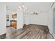 Open concept living space with wood flooring and a ceiling fan at 49 Country Ct, Alpharetta, GA 30005