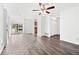 Inviting living room with wood-look floors, neutral walls, and glass sliding door at 49 Country Ct, Alpharetta, GA 30005