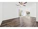Spacious living area with sleek wood-look flooring, lots of light and a ceiling fan at 49 Country Ct, Alpharetta, GA 30005