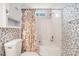 Bathroom with a tub, toilet, and floral wallpaper at 7324 Drake Ave, Lithonia, GA 30058