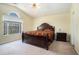 Bedroom with vaulted ceiling, a large window and a nicely decorated bed at 7324 Drake Ave, Lithonia, GA 30058