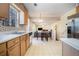 Kitchen with light wood cabinets with adjacent dining and living space at 7324 Drake Ave, Lithonia, GA 30058