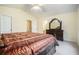Spacious main bedroom with a large bed, vaulted ceiling, and connecting bathroom at 7324 Drake Ave, Lithonia, GA 30058
