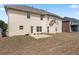 A great backyard view of the property with lawn space and a small patio at 765 Rock Ln, Mcdonough, GA 30253