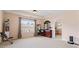 Spacious bedroom with large window, tray ceiling, dresser, and neutral carpet at 765 Rock Ln, Mcdonough, GA 30253