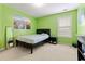 Bedroom with modern decor and cityscape art, offering a comfortable and stylish space at 765 Rock Ln, Mcdonough, GA 30253