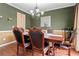 Cozy dining room with hardwood floors and a classic chandelier at 765 Rock Ln, Mcdonough, GA 30253