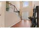 Bright foyer with hardwood floors, staircase, and high ceilings at 765 Rock Ln, Mcdonough, GA 30253