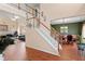 Spacious foyer showcasing hardwood floors and a graceful staircase at 765 Rock Ln, Mcdonough, GA 30253