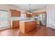 Charming kitchen features an island, modern appliances, and lots of counter space at 765 Rock Ln, Mcdonough, GA 30253