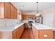 Bright kitchen with wooden cabinets, white marble countertops, and an island with a sink at 765 Rock Ln, Mcdonough, GA 30253