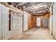 Unfinished basement with exposed ceiling and concrete floors at 1092 Shumard Ln, Mcdonough, GA 30252