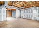 Unfinished basement with exposed ceiling and concrete floors at 1092 Shumard Ln, Mcdonough, GA 30252