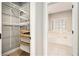 A walk-in closet and a bathroom with tub can be seen through the doorway at 1092 Shumard Ln, Mcdonough, GA 30252