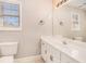 Bathroom with a window above a large vanity at 1092 Shumard Ln, Mcdonough, GA 30252