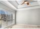 Bedroom with a trey ceiling, ceiling fan and a large window letting in ample light at 1092 Shumard Ln, Mcdonough, GA 30252