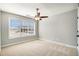 Bedroom with a ceiling fan, neutral carpet, and natural light at 1092 Shumard Ln, Mcdonough, GA 30252