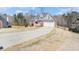 Charming home featuring a two-car garage and a long driveway at 1092 Shumard Ln, Mcdonough, GA 30252