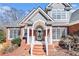 Close-up of the front porch featuring brick steps, white railings, and a glass front door at 1092 Shumard Ln, Mcdonough, GA 30252
