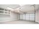 Spacious garage with overhead lighting and storage racks at 1092 Shumard Ln, Mcdonough, GA 30252