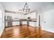 Modern kitchen featuring white cabinets, stainless steel appliances, and sleek dark countertops at 1092 Shumard Ln, Mcdonough, GA 30252