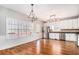 Spacious kitchen with stainless steel appliances, white cabinets, and hardwood flooring at 1092 Shumard Ln, Mcdonough, GA 30252