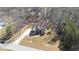 Aerial view of a beautiful two-story home with mature trees and a well-manicured lawn at 25 Mountain Crest Dr, Oxford, GA 30054