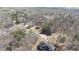 A wide aerial shot showing homes amid dense trees, highlighting the community's secluded location at 25 Mountain Crest Dr, Oxford, GA 30054