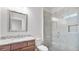 Modern bathroom showcasing a tiled shower with glass door, sleek vanity and fixtures at 25 Mountain Crest Dr, Oxford, GA 30054