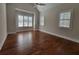 Spacious bedroom boasts hardwood floors, natural light from multiple windows, and a modern ceiling fan at 25 Mountain Crest Dr, Oxford, GA 30054