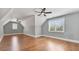 Spacious bonus room with hardwood floors, ceiling fans, and bright natural light at 25 Mountain Crest Dr, Oxford, GA 30054