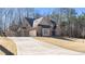 Beautiful brick two-story home with attached garage and long concrete driveway at 25 Mountain Crest Dr, Oxford, GA 30054