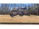 Stunning two-story brick home with beautiful architectural details and landscaping at 25 Mountain Crest Dr, Oxford, GA 30054