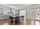 Kitchen island with bar seating, granite countertops, and stainless steel appliances at 25 Mountain Crest Dr, Oxford, GA 30054