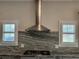 Close up of stainless steel hood over cooktop and backsplash at 25 Mountain Crest Dr, Oxford, GA 30054