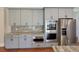 Kitchen cabinets with stainless steel appliances and marble countertops at 25 Mountain Crest Dr, Oxford, GA 30054