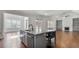 Open concept kitchen with island, marble countertops, and hardwood flooring at 25 Mountain Crest Dr, Oxford, GA 30054