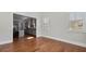 Bright living room featuring hardwood floors, natural light, and an open view into the modern kitchen at 25 Mountain Crest Dr, Oxford, GA 30054
