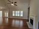 Living room showcasing hardwood floors, a fireplace, and a large window at 25 Mountain Crest Dr, Oxford, GA 30054