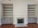 Elegant living room with a central fireplace and stylish built-in shelving at 25 Mountain Crest Dr, Oxford, GA 30054