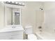 Bathroom with white vanity, mirror, and tub with shower head at 1166 Booth Sw Rd # 605, Marietta, GA 30008