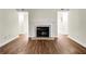 Living room with fireplace, mantle and tile hearth with updated laminate flooring at 1166 Booth Sw Rd # 605, Marietta, GA 30008