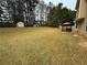 Spacious backyard featuring a shed and a patio area, perfect for outdoor entertaining and relaxation at 2469 Briar Knoll Rd, Lithonia, GA 30058
