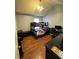 Cozy bedroom featuring a bunk bed, wood floors, and a well-lit study area, offering a functional and comfortable space at 2469 Briar Knoll Rd, Lithonia, GA 30058