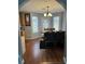 Cozy dining area with natural light, a chandelier, and a view into the kitchen at 2469 Briar Knoll Rd, Lithonia, GA 30058