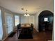 Cozy dining room features a wooden table with seating for four and a decorative lighting fixture at 2469 Briar Knoll Rd, Lithonia, GA 30058