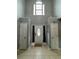 Bright foyer features a large window above the front door and tiled flooring at 2469 Briar Knoll Rd, Lithonia, GA 30058