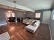 Spacious living area with wood floors and access to the dining room at 2469 Briar Knoll Rd, Lithonia, GA 30058