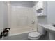 Bathroom featuring a shower-tub combo, sink and cabinet at 3844 Oglesby Rd, Powder Springs, GA 30127