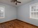 Bedroom featuring hardwood floors, neutral paint, and abundant natural light at 3844 Oglesby Rd, Powder Springs, GA 30127